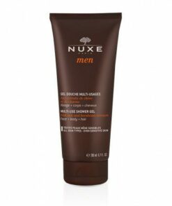 Flacon noir et argent du Gel Douche Multi-usages Nuxe MEN posé sur un fond moderne.